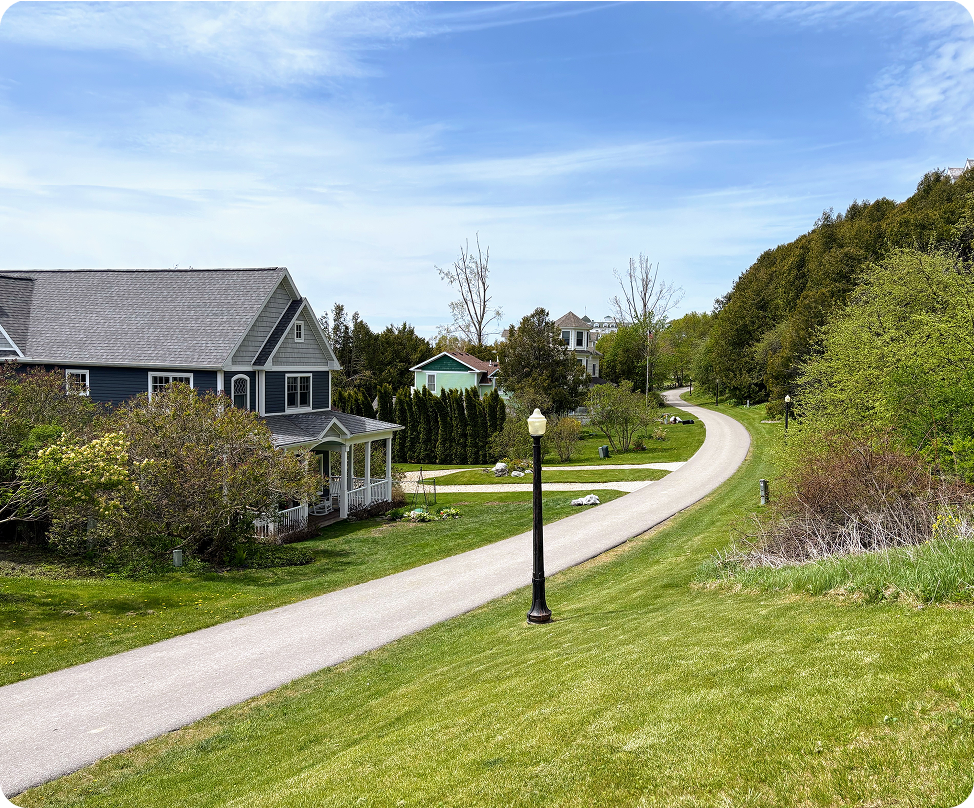 Suburban houses along a winding path.